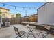 Backyard patio with a table and chairs, perfect for outdoor entertaining at 3521 Osage St, Denver, CO 80211