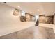 Partially finished basement featuring stone wall accents and access to the upper floor at 3521 Osage St, Denver, CO 80211