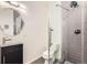 Modern bathroom features a glass-enclosed shower, sleek vanity, and contemporary fixtures, offering a spa-like experience at 3521 Osage St, Denver, CO 80211