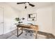 Bright bedroom space with a fan, desk, and modern artwork, creating a comfortable atmosphere at 3521 Osage St, Denver, CO 80211
