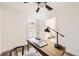 Bedroom featuring a ceiling fan, desk area, and window allowing natural light at 3521 Osage St, Denver, CO 80211