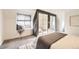 Cozy bedroom featuring a window seat, soft carpeting, and closet with mirrored doors at 3521 Osage St, Denver, CO 80211