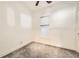 Cozy bedroom with neutral carpeting and a window letting in natural light at 3521 Osage St, Denver, CO 80211