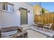 Charming cottage exterior with a private patio area and wooden fence at 3521 Osage St, Denver, CO 80211