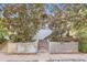 Charming two-story home with a brick staircase surrounded by mature trees and landscaped details at 3521 Osage St, Denver, CO 80211