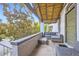 Spacious front porch featuring comfortable seating, a stylish coffee table, and a welcoming entrance at 3521 Osage St, Denver, CO 80211