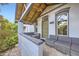 Inviting front porch with comfortable seating area and stylish design elements, perfect for relaxing outdoors at 3521 Osage St, Denver, CO 80211
