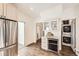 Contemporary kitchen with stainless steel appliances, a wine cooler, and modern finishes at 3521 Osage St, Denver, CO 80211
