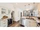 Well-lit kitchen featuring stainless steel appliances and granite countertops at 3521 Osage St, Denver, CO 80211