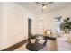 Bright living room with white walls, hardwood floors, modern decor, and plenty of natural light at 3521 Osage St, Denver, CO 80211