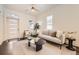 Cozy living room featuring a stylish sofa, modern coffee table, and ample natural light at 3521 Osage St, Denver, CO 80211