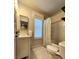 Well-lit bathroom featuring modern fixtures, vanity with storage, and shower-tub combination at 13640 Garfield St # A, Thornton, CO 80602
