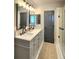 Spacious bathroom with dual sinks, modern fixtures, and a glass-enclosed shower for a luxurious feel at 13640 Garfield St # A, Thornton, CO 80602