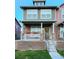 Charming two-story home with a stone facade, covered porch, and flower boxes for added curb appeal at 13640 Garfield St # A, Thornton, CO 80602