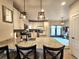 Bright kitchen with granite countertops, stainless steel appliances, and a functional island at 13640 Garfield St # A, Thornton, CO 80602
