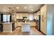 Well-equipped kitchen with stainless appliances, ample counter space and an island with barstool seating at 13640 Garfield St # A, Thornton, CO 80602