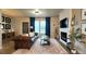 Cozy living room featuring a fireplace, comfortable seating, and stylish decor at 13640 Garfield St # A, Thornton, CO 80602