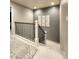 Bright staircase featuring modern railing and decorative wall art creating a warm and inviting space at 13640 Garfield St # A, Thornton, CO 80602