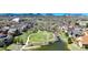 Beautiful aerial view of a residential neighborhood featuring a park, pond, and mountain views at 5822 S Van Gordon Ln, Littleton, CO 80127