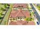 Aerial shot of townhomes with brown roofs, green lawns, and access to parking areas at 5822 S Van Gordon Ln, Littleton, CO 80127