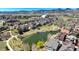 Picturesque aerial shot showcases a neighborhood park with a pond surrounded by homes, enhancing the community's appeal at 5822 S Van Gordon Ln, Littleton, CO 80127