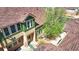 Attractive townhome exterior with a well-maintained roof, complemented by a beautiful tree at 5822 S Van Gordon Ln, Littleton, CO 80127