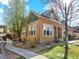 Beautiful home exterior with well-kept lawn, mature trees, and a charming walkway to the front door at 5822 S Van Gordon Ln, Littleton, CO 80127