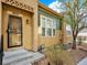 Welcoming front entrance of a home with a well-kept yard and appealing architectural details at 5822 S Van Gordon Ln, Littleton, CO 80127