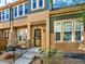 Inviting townhouse entrance with a charming front door and well-maintained landscaping at 5822 S Van Gordon Ln, Littleton, CO 80127
