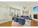 Bright living room with hardwood floors, a fireplace, and multiple seating options for relaxation and entertaining at 5822 S Van Gordon Ln, Littleton, CO 80127