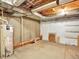 Large unfinished basement provides ample storage and features exposed utilities at 5822 S Van Gordon Ln, Littleton, CO 80127