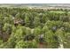Aerial view of a home surrounded by mature trees and greenery at 510 Silhouette Way, Monument, CO 80132