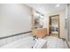 Bathroom features a jacuzzi soaking tub and double sink vanity with views to bedroom at 510 Silhouette Way, Monument, CO 80132