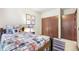 Comfortable bedroom with a wooden bed frame and ample closet space at 510 Silhouette Way, Monument, CO 80132