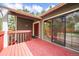 Exterior view of a wood deck with outdoor furniture and a sliding glass door at 510 Silhouette Way, Monument, CO 80132