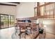 Bright dining area with natural light, featuring a wooden table, chairs, and an open layout at 510 Silhouette Way, Monument, CO 80132