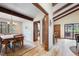 Formal dining room boasts wood beams and seamless transition to the outdoors at 510 Silhouette Way, Monument, CO 80132