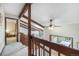 Hallway with wooden beams and staircase, offering a bright and airy passage at 510 Silhouette Way, Monument, CO 80132