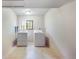 Bright laundry room with white washer, dryer, tile floor, and natural light at 510 Silhouette Way, Monument, CO 80132