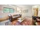 Comfortable living room with a stylish leather couch, glass table and view to the exterior at 510 Silhouette Way, Monument, CO 80132