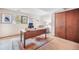 Cozy home office features a wooden desk, decor, and a window for natural light at 510 Silhouette Way, Monument, CO 80132