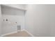 Laundry room with overhead shelving and a laundry chute at 42888 Ivydel St, Elizabeth, CO 80107