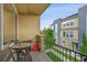 Cozy balcony with seating area, wrought iron railing, and outdoor views at 6745 S Tempe Ct, Aurora, CO 80016