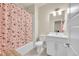 Bright bathroom featuring a shower with a Princess themed curtain and a vanity at 6745 S Tempe Ct, Aurora, CO 80016