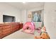 Cute bedroom featuring a pink toy tent, a dresser, and kid-friendly decor at 6745 S Tempe Ct, Aurora, CO 80016