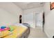 Bedroom features a closet, yellow themed covers and playful elements at 6745 S Tempe Ct, Aurora, CO 80016