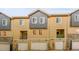 A street view of the exterior of the town home with garages at 6745 S Tempe Ct, Aurora, CO 80016