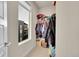 Well-organized walk-in closet with a window, shelving, and ample storage space at 6745 S Tempe Ct, Aurora, CO 80016