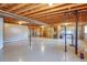 Spacious unfinished basement with exposed beams, ready to be customized at 40 Charlou Cir, Cherry Hills Village, CO 80111