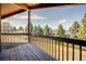 View from the deck with wooden planks and railings overlooking the neighborhood at 40 Charlou Cir, Cherry Hills Village, CO 80111